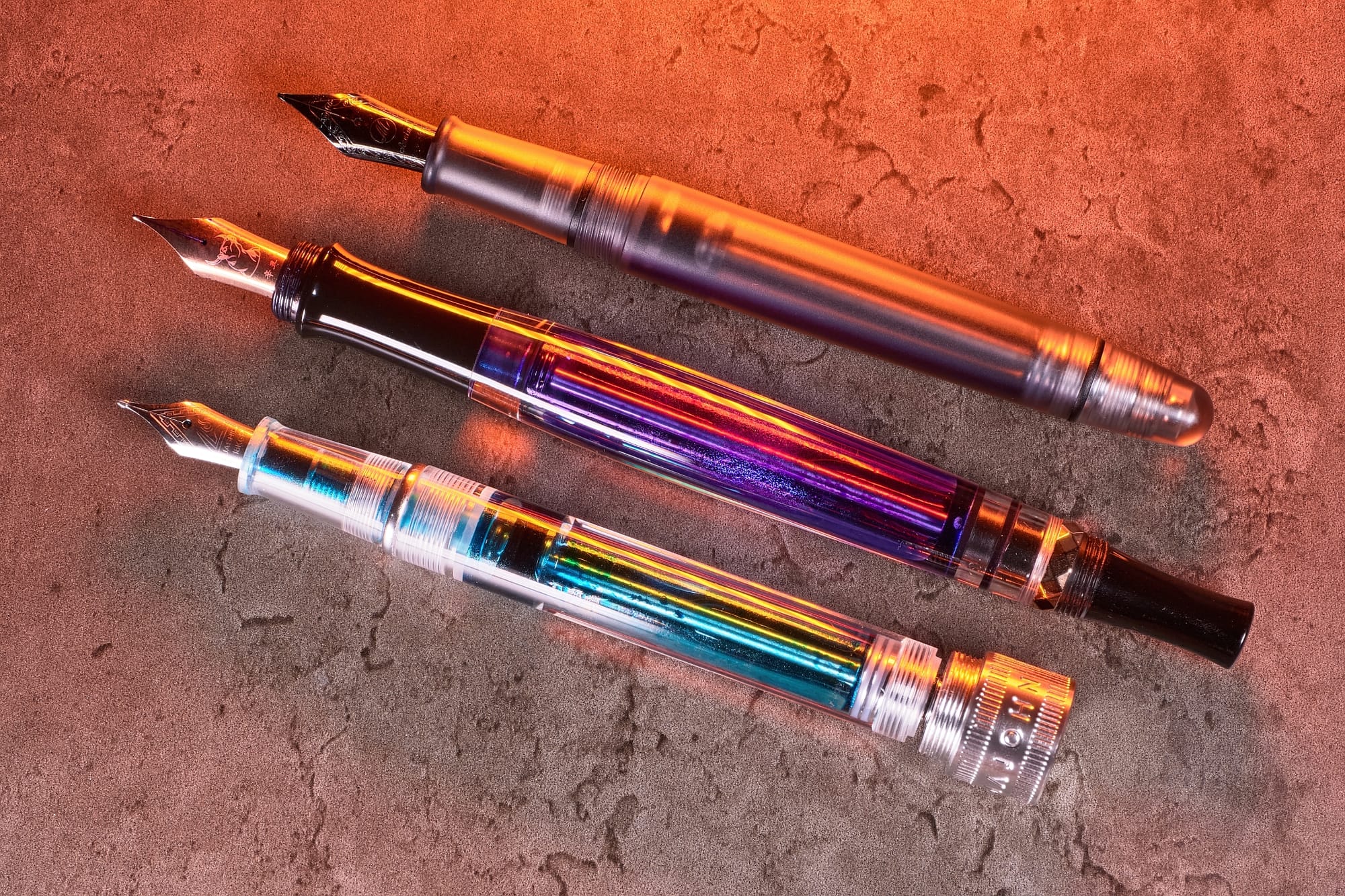 Photo of 3 different types of vacuum filler fountain pens.