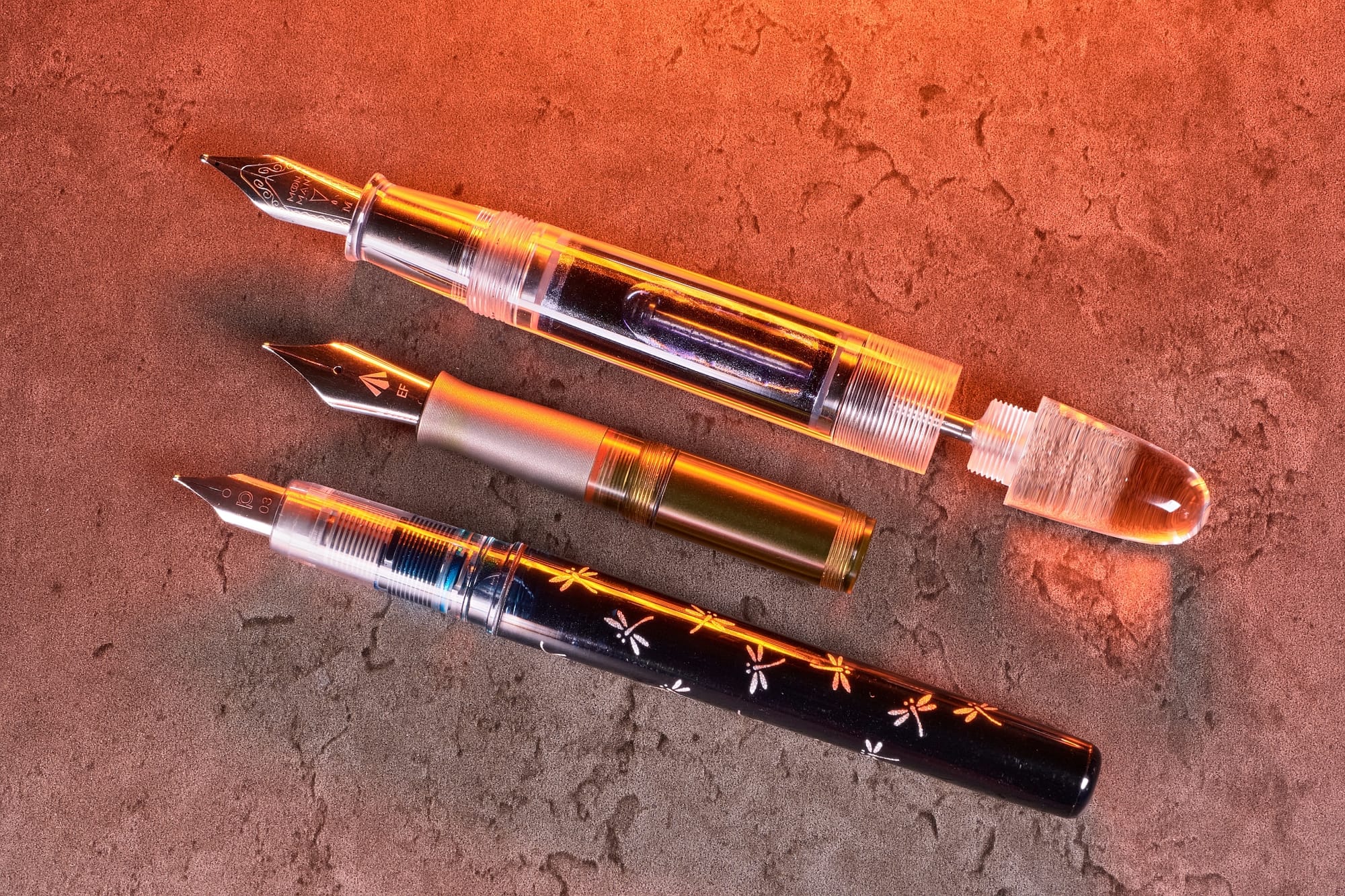 Photo of 3 different eyedropper fountain pens.